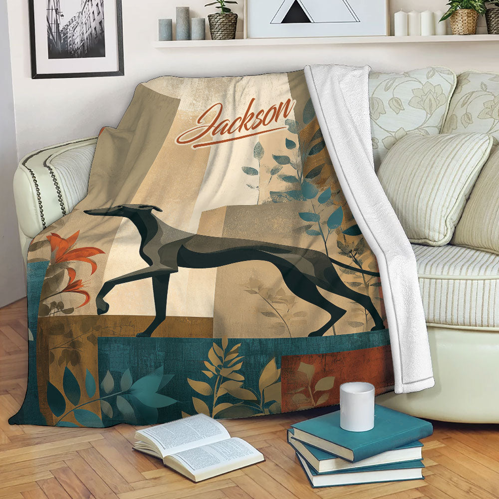 Whippet throw blanket displayed on a sofa with botanical artwork and warm neutral, teal, and rust tones