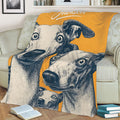 Close view of a Whippet throw blanket with expressive illustrated dogs in orange and navy