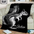 High-contrast squirrel throw blanket draped over a sofa in a cozy living room