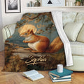 Squirrel blanket draped over a sofa with woodland artwork and cozy living room decor