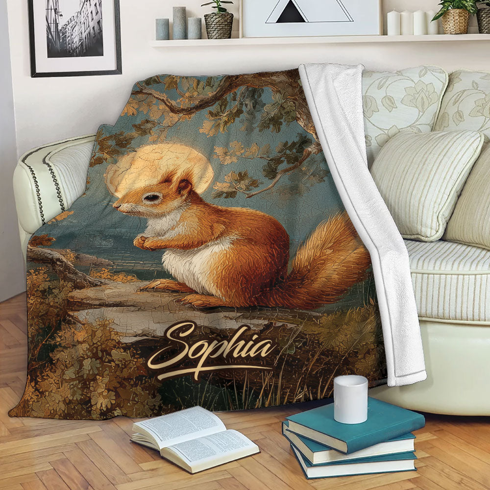 Squirrel blanket draped over a sofa with woodland artwork and cozy living room decor