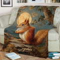 Woodland squirrel throw blanket displayed on a sofa with moonlit forest artwork