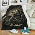 Biker throw blanket displayed on a sofa with dramatic skull rider and motorcycle artwork