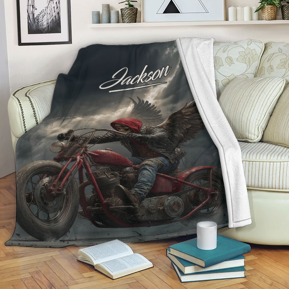 Biker blanket draped over a sofa with dramatic motorcycle rider and storm cloud artwork