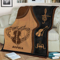 Close view of a violin throw blanket on a sofa featuring violin illustrations and music notes