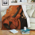 Violin throw blanket displayed on a sofa with rich brown musical artwork in a cozy living room
