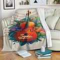 Violin throw blanket displayed on a sofa with floral music artwork and a cozy living room setting