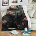 Floral violin throw blanket draped across a sofa in a cozy living room reading space
