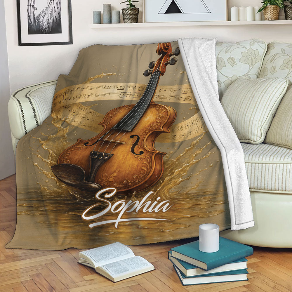 Violin throw blanket draped over a sofa with dramatic instrument artwork and musical notes in a cozy room