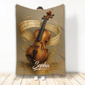 Violin throw blanket displayed upright with ornate violin artwork, flowing sheet music, and warm golden tones