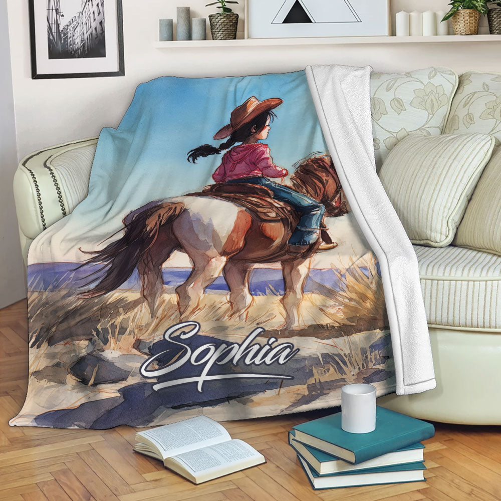Cowgirl horse artwork displayed as a cozy throw blanket on a living room sofa