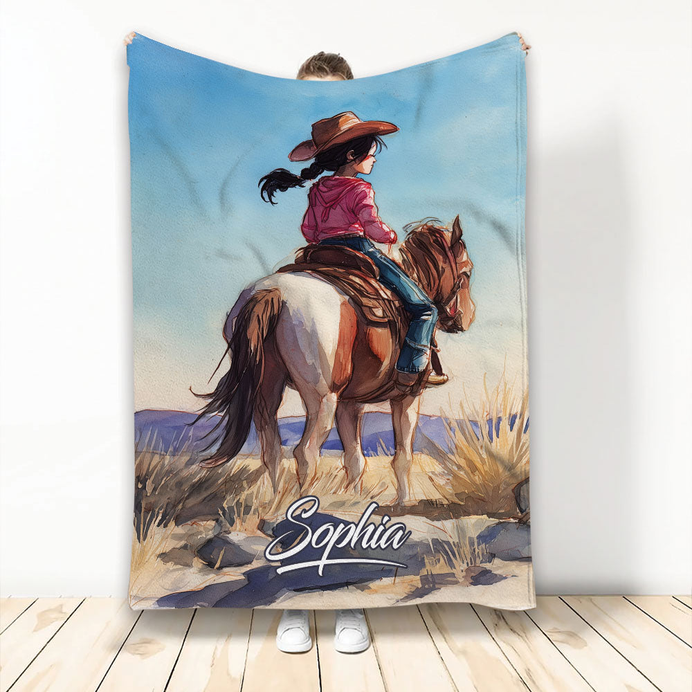 Cowgirl riding a horse in a western landscape on a custom western art blanket