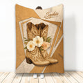 Cowgirl throw blanket featuring ornate Western boots, floral accents, and warm rustic artwork