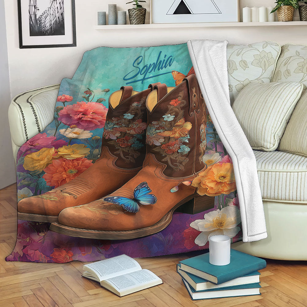 Floral western boots throw blanket draped over a sofa with colorful flowers and butterfly artwork