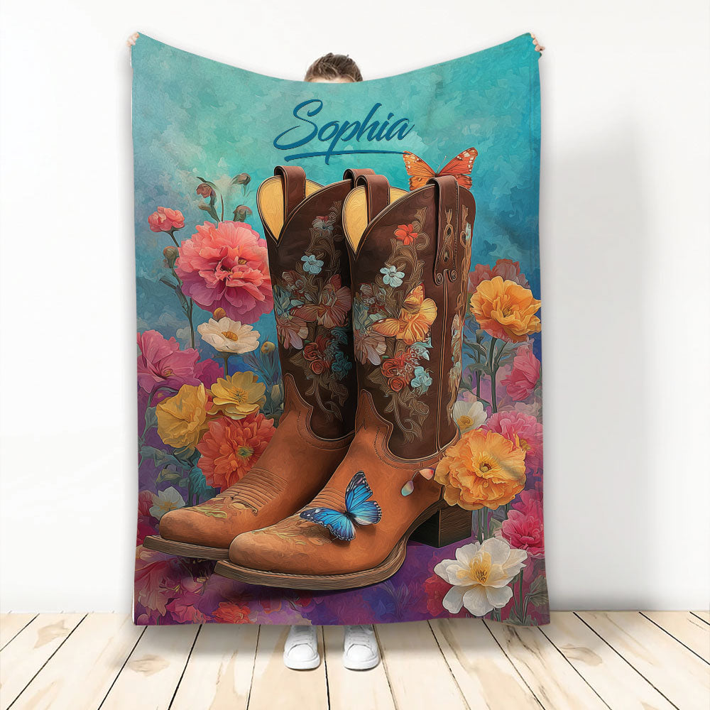 Floral cowgirl throw blanket featuring embellished western boots, colorful flowers, butterflies, and turquoise artwork