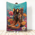 Floral cowgirl throw blanket featuring embellished western boots, colorful flowers, butterflies, and turquoise artwork