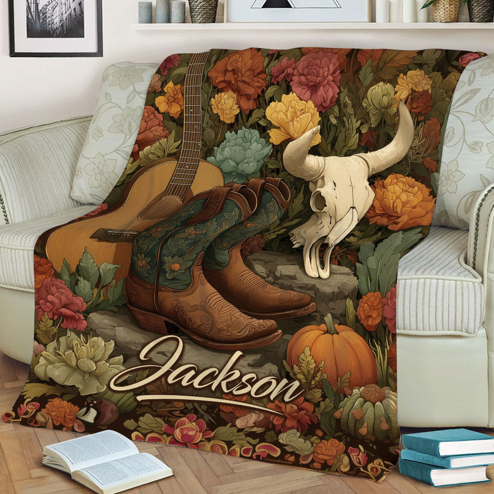 Rustic cowgirl throw blanket displayed on a couch with boots, guitar and Western skull artwork