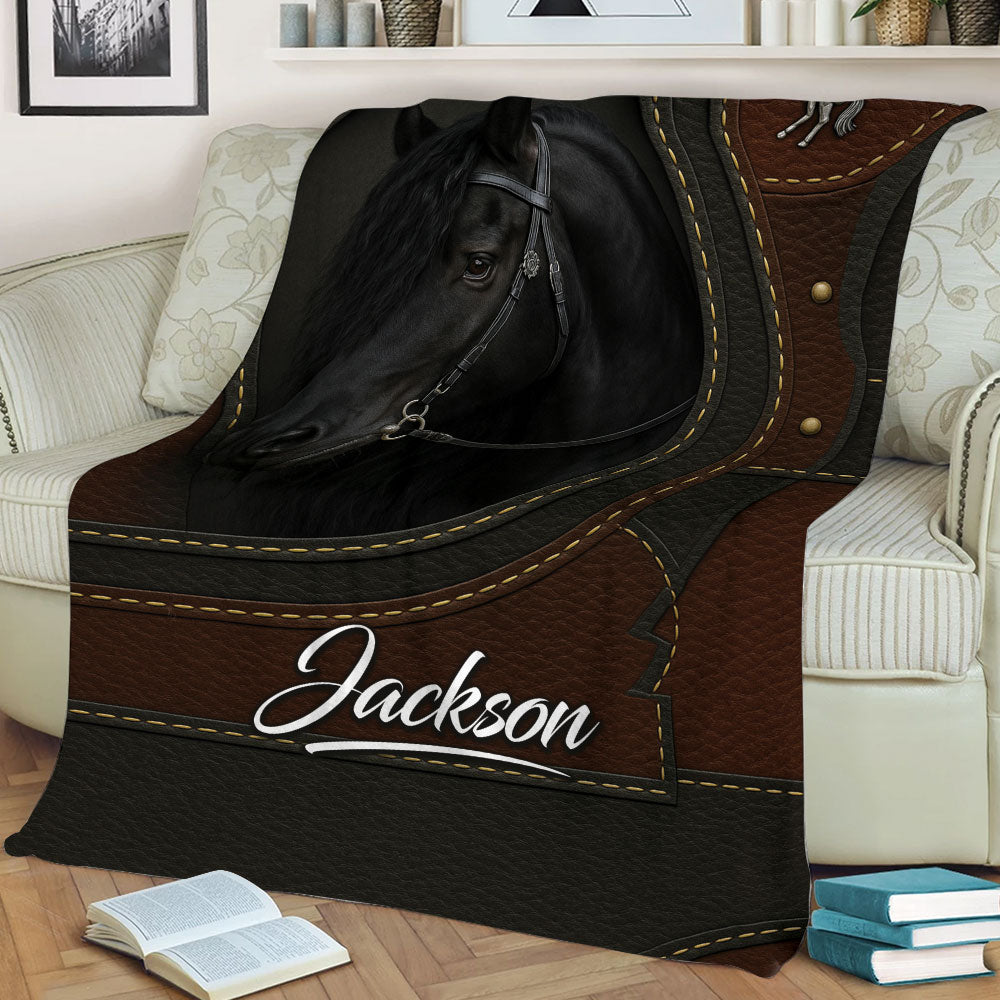Equestrian horse blanket styled across a sofa with detailed black horse artwork