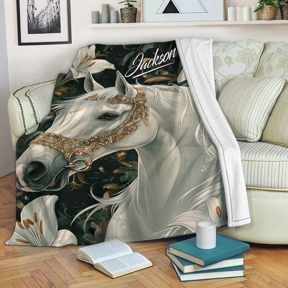 Horse throw blanket displayed on a sofa with elegant white horse artwork, lilies, and dark botanical details