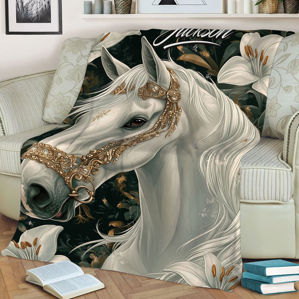 Close-up horse blanket draped over a sofa, featuring a white horse, ornate bridle, and floral artwork