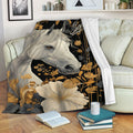 Horse blanket draped over a sofa with elegant black, gold, and gray floral design