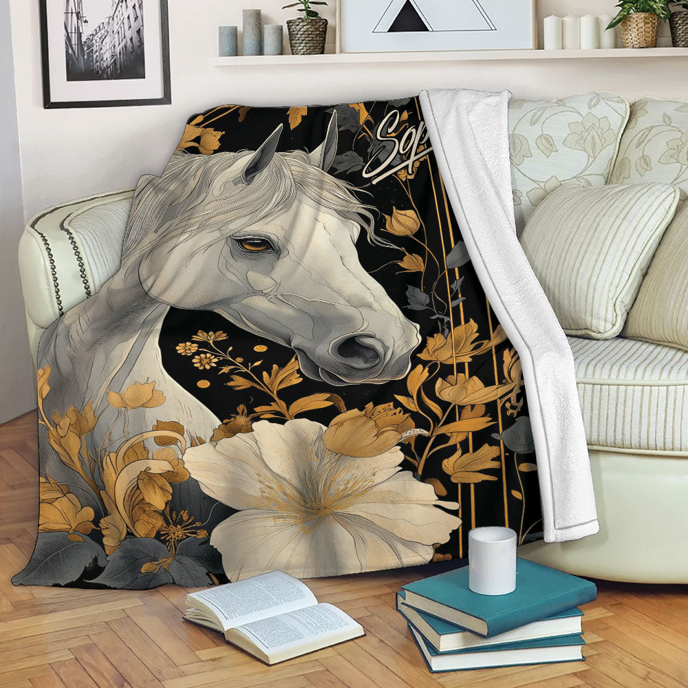 Horse blanket draped over a sofa with elegant black, gold, and gray floral design