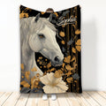 Horse throw blanket featuring a detailed white horse surrounded by gold and gray floral artwork