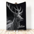 Black throw blanket featuring a detailed white line-art stag with large antlers