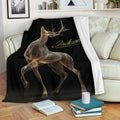 Custom deer throw blanket displayed on a sofa with elegant gold wildlife artwork