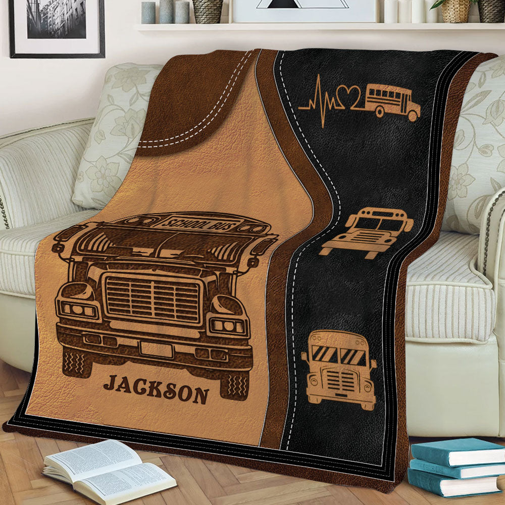 Close view of a vintage school bus throw blanket styled across a couch