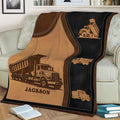 Close view of a dump truck throw blanket with vintage-inspired sepia and black artwork