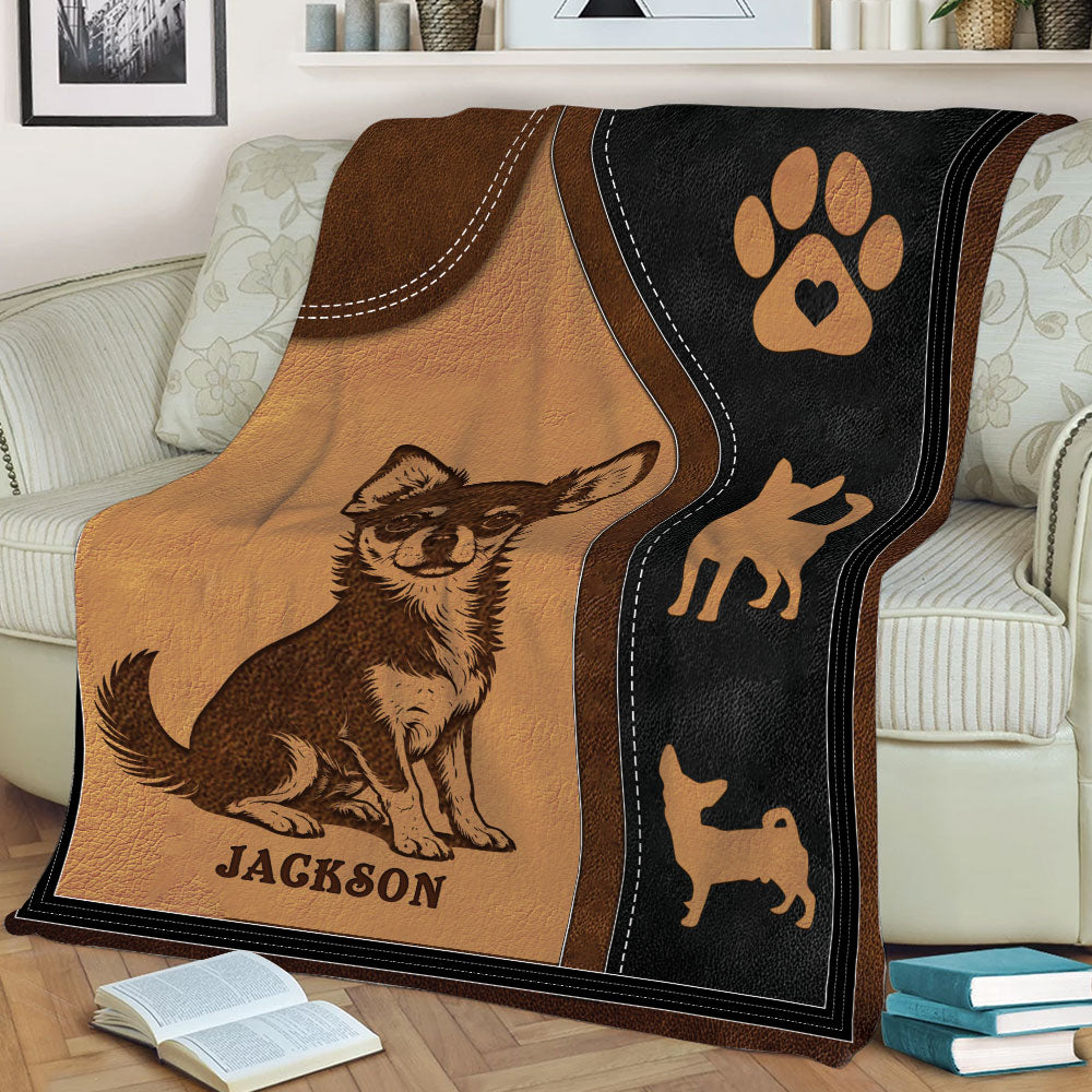 Close lifestyle view of a Chihuahua throw blanket featuring a seated dog and paw print design