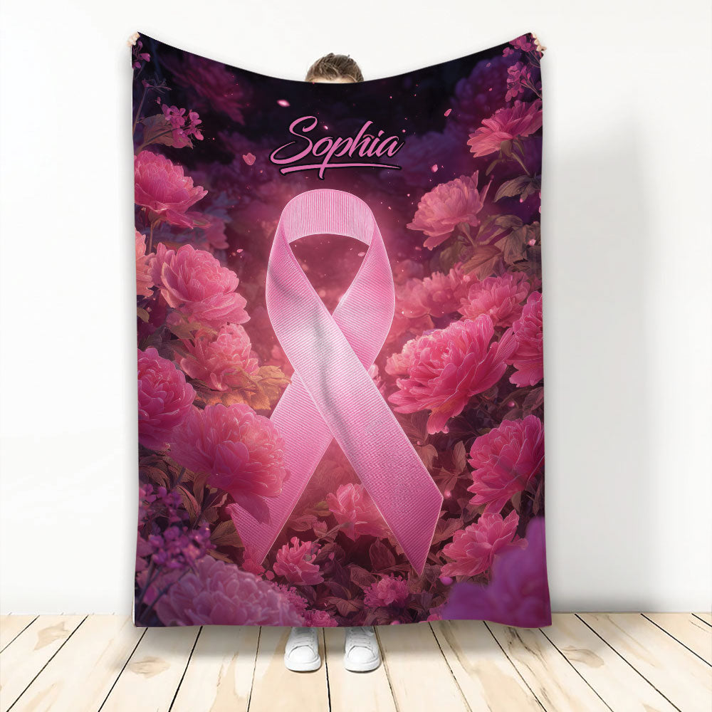 Breast cancer awareness blanket with a pink ribbon surrounded by vibrant pink flowers