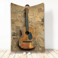 Custom guitar blanket featuring a vintage acoustic guitar and newspaper collage artwork