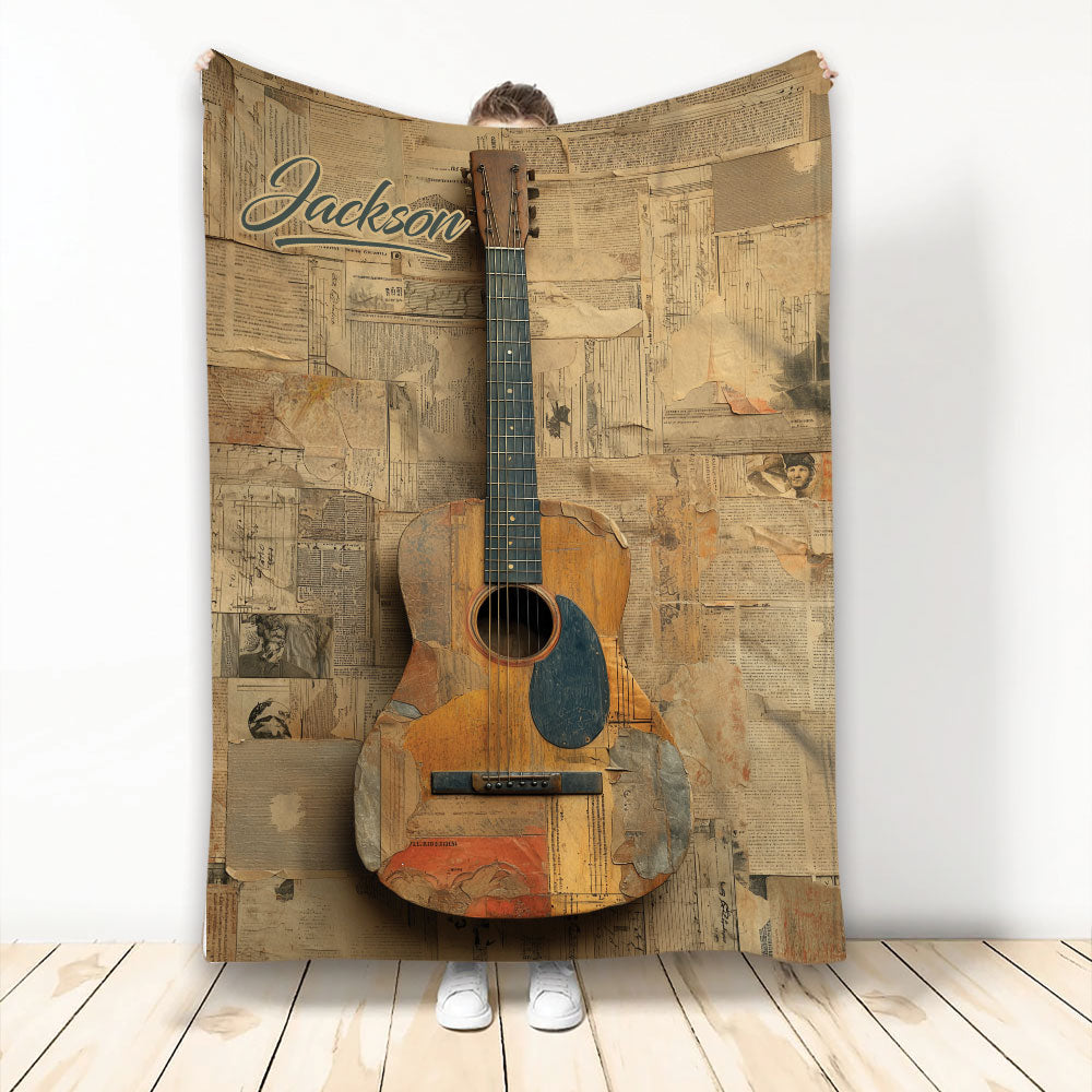 Custom guitar blanket featuring a vintage acoustic guitar and newspaper collage artwork
