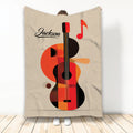 Guitar throw blanket with bold orange, red, and black acoustic guitar artwork and musical note