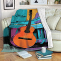 Colorful guitar throw blanket draped over a sofa in a cozy living room