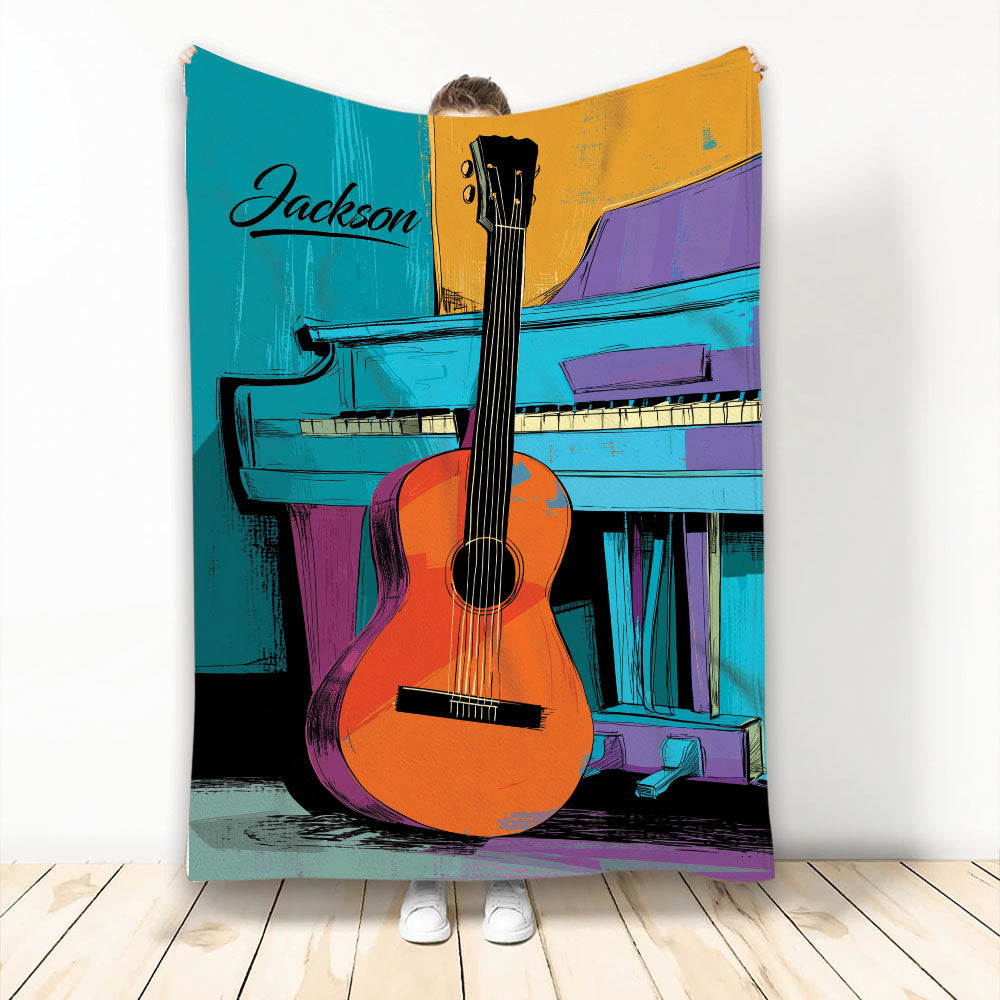Colorful guitar and piano artwork displayed across a blanket in a bright music-inspired design