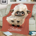 Close view of a fluffy cartoon sheep throw blanket displayed across a sofa