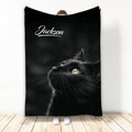 Black cat throw blanket displayed vertically with realistic feline artwork on a dark background