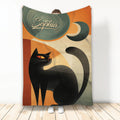 Black cat throw blanket with retro geometric artwork, crescent moon motif, and warm orange and green colors