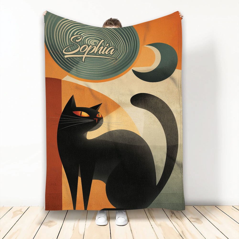 Black cat throw blanket with retro geometric artwork, crescent moon motif, and warm orange and green colors