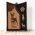 Miniature Pinscher throw blanket with warm brown and black dog artwork and paw print accents