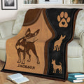 Close view of Miniature Pinscher throw blanket featuring a distinctive dog illustration and paw print