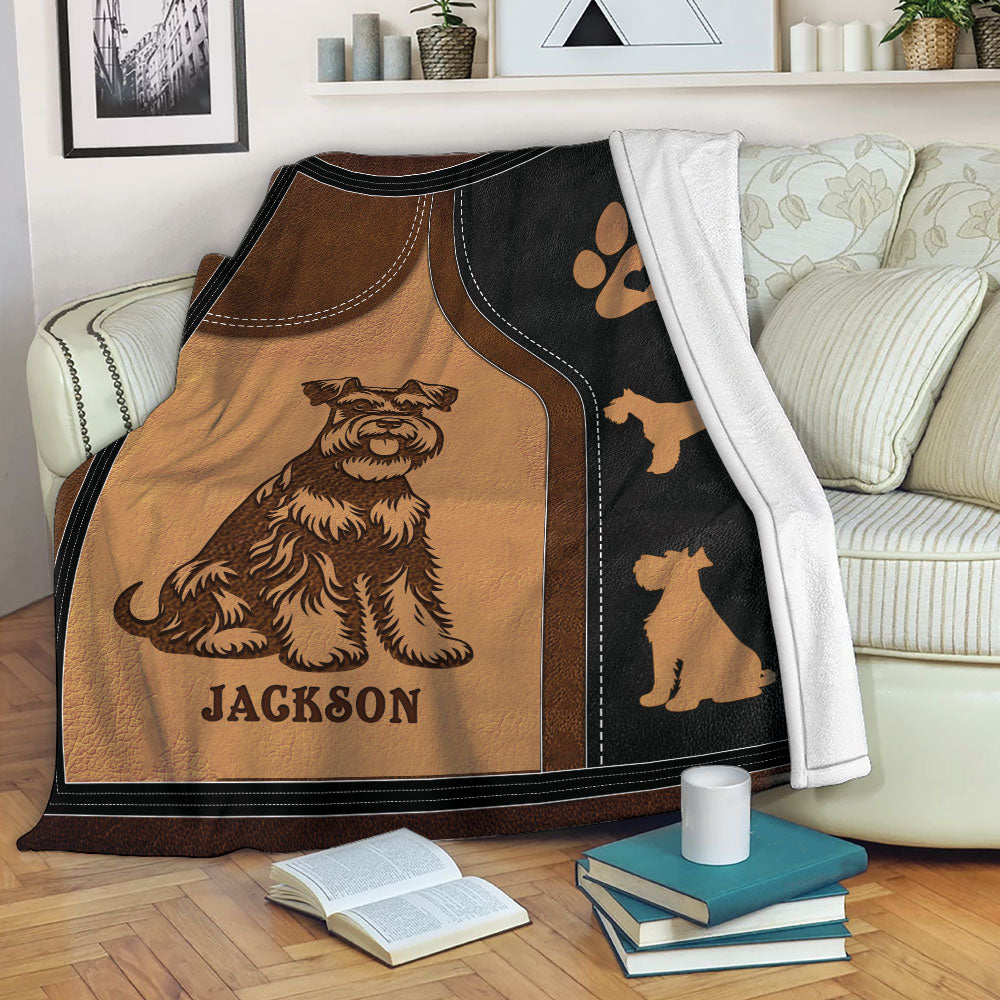 Miniature Schnauzer throw blanket displayed on a sofa with rustic dog artwork and paw print