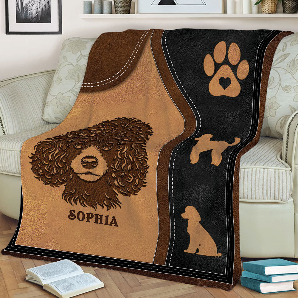 Close lifestyle view of a Poodle throw blanket featuring a curly dog portrait and paw print