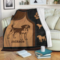 Beagle throw blanket displayed on a sofa with warm brown and black dog-themed artwork