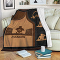 DJ throw blanket displayed on a sofa with turntable artwork, headphones, speakers, and music silhouettes