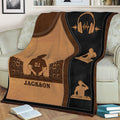 Close view of a custom DJ throw blanket with turntables, speaker stacks, and headphone artwork