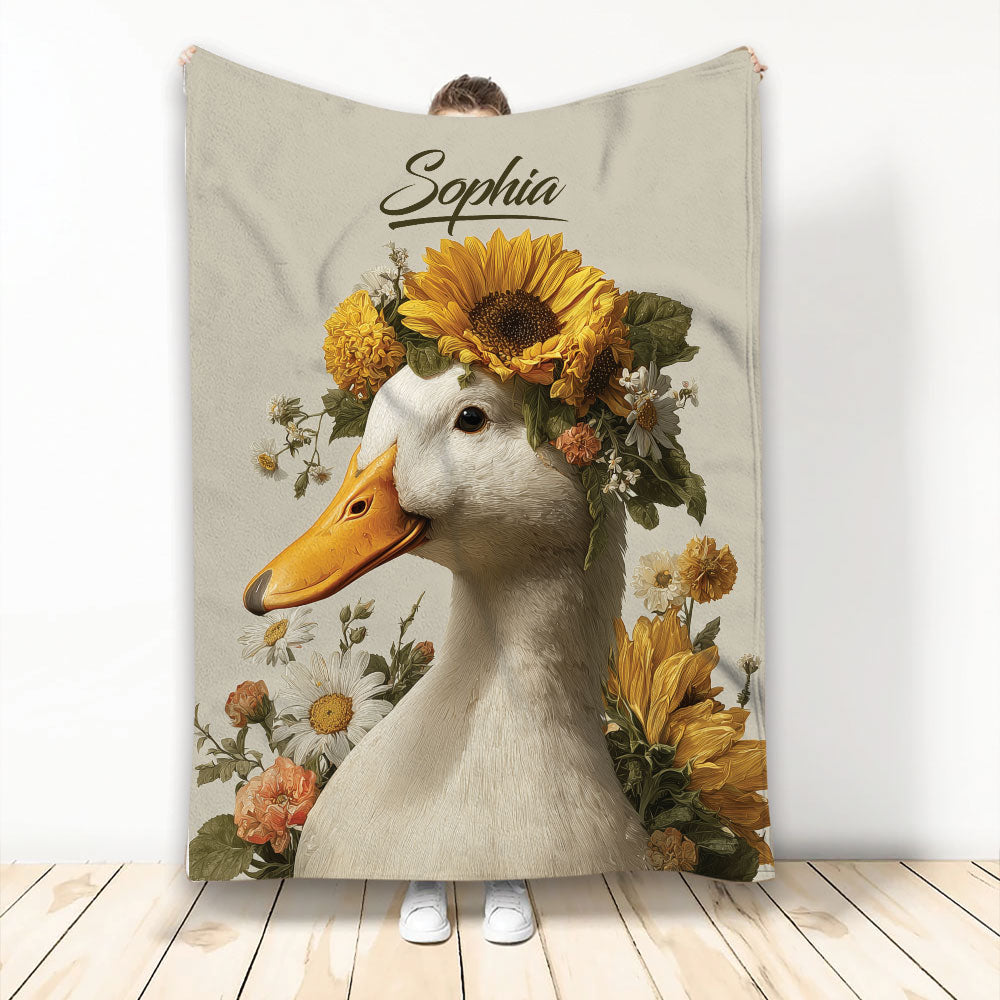 Custom duck blanket featuring a white duck surrounded by sunflowers and colorful botanical flowers